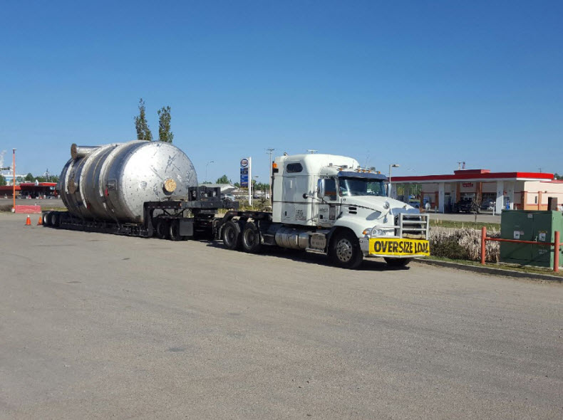 (Pulp Mill) double drop expando tank trailer extra ordinary load going to Peace River, Alberta